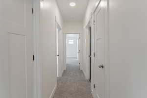 Hallway with light carpet