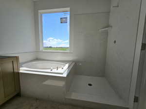 Bathroom with shower with separate bathtub