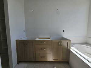 Bathroom with tiled bath