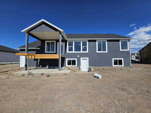 Rear view of house featuring a patio