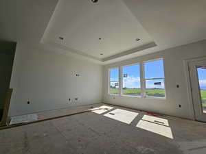 Spare room featuring a raised ceiling