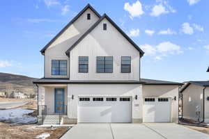 Modern farmhouse featuring a garage