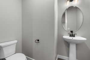 Bathroom with sink and toilet