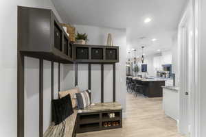 Mudroom featuring light wood-type flooring