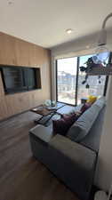 Living room with dark wood-type flooring