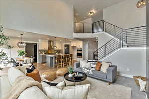 Living room featuring a towering ceiling