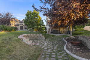 Terraced are of backyard with lots of space for patio furniture and entertainment