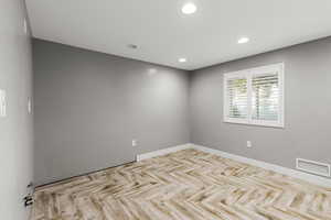 Large Spacious Basement plumbed for a kitchenette or wet bar with custom tile flooring