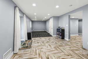 Large Spacious Basement plumbed for a kitchenette or wet bar with custom tile flooring with walkout access