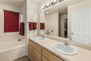 Primary en suite bathroom with separate Garden Tub and Shower, with Dual Vanities