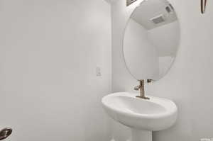 Bathroom with sink and a textured ceiling