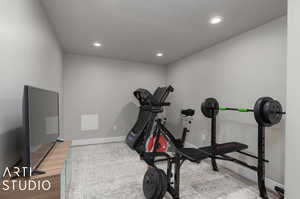 Exercise room featuring hardwood / wood-style flooring