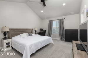 Carpeted bedroom featuring ceiling fan and lofted ceiling