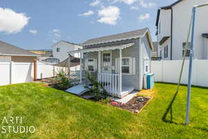 Back of house featuring playhouse