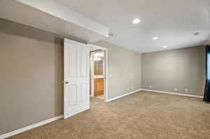 Unfurnished bedroom with carpet floors