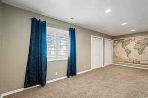 Unfurnished room with carpet flooring