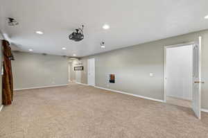 Spare room featuring light colored carpet