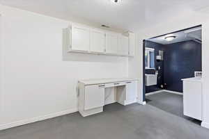 Unfurnished office featuring a textured ceiling