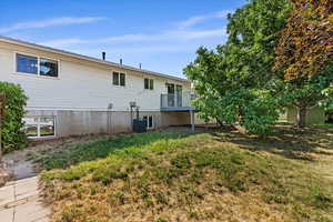 Back of property featuring central air condition unit