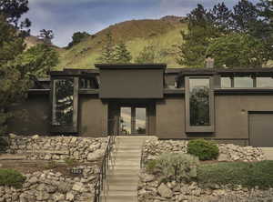 View of front of property featuring a mountain view and a garage