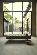 Interior space featuring concrete flooring and expansive windows