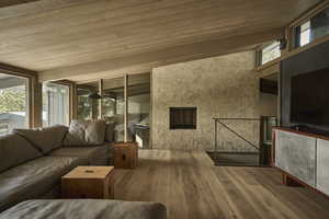 Living room featuring wood ceiling, beamed ceiling, and hardwood / wood-style flooring