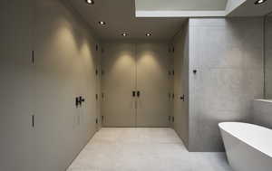 Bathroom with a bathtub and tile patterned floors