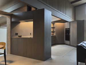 Interior space with concrete floors and double oven