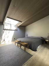 Bedroom with hardwood / wood-style floors and wooden ceiling