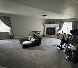 Large basement Family Room with fireplace and lots of natural light