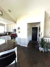 Kitchen with lofted ceiling