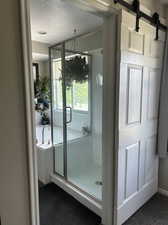 Primary Bathroom with soaking tub and shower, great natural light