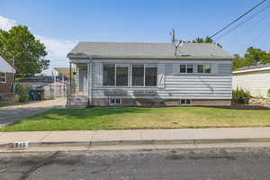 View of front of house featuring a front lawn