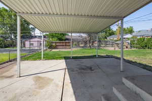 View of patio featuring a storage shed