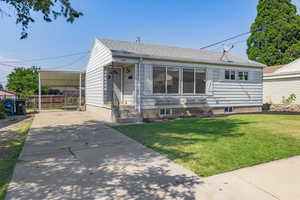 View of front of property featuring a front yard