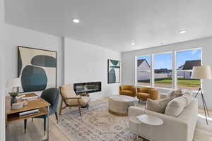 Living room with light hardwood / wood-style flooring