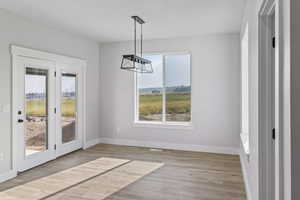 Unfurnished dining area with light hardwood / wood-style floors