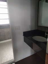 Bathroom with tile patterned floors and vanity