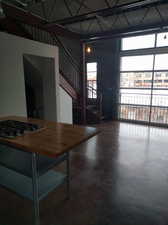 Unfurnished dining area featuring concrete floors