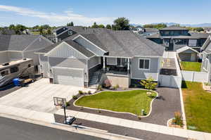 View of front of home with a garage and a front yard