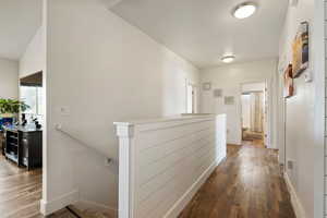 Corridor featuring hardwood / wood-style flooring