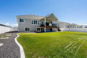 Back of house featuring a lawn