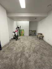 Exercise room with carpet flooring