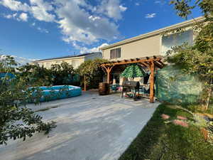 View of patio with a pergola and grilling area