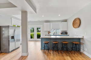 2nd kitchenette on lower level with back yard access, & new cabinets.