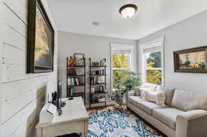 Main floor office with french doors and ship lap walls