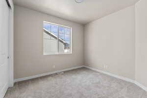 Empty room featuring carpet floors