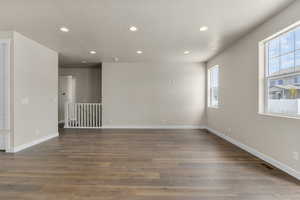 Spare room with hardwood / wood-style flooring