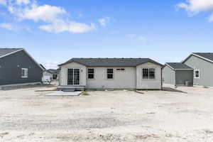 Back of house featuring central AC