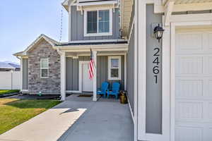 Doorway to property featuring a garage